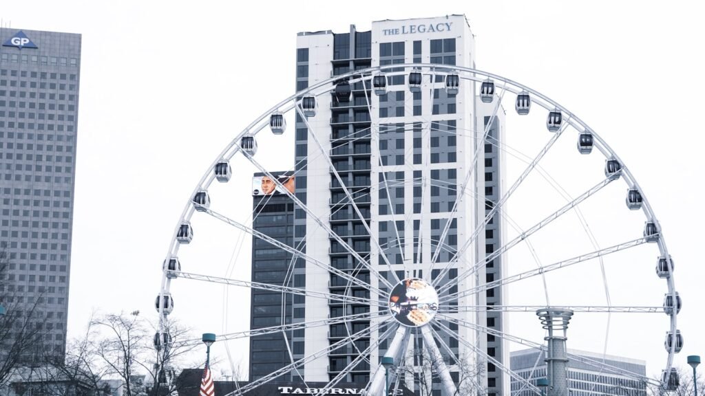 Skyview Atlanta ferris wheel in front of a tall building